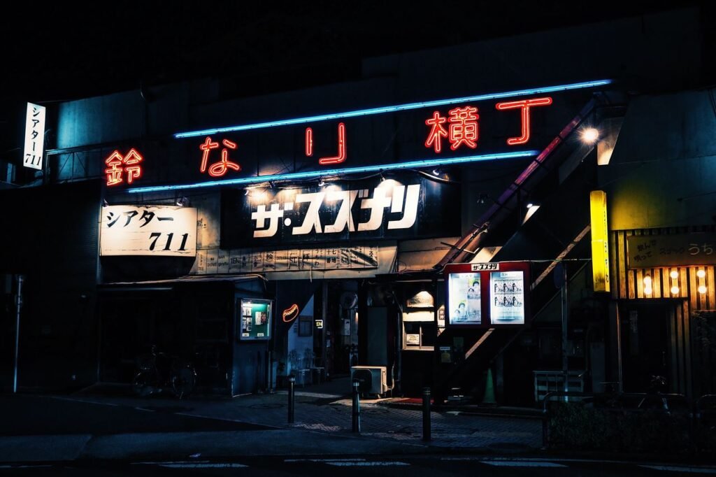 Explore Tokyo's nightlife with a neon-lit theater showcasing vibrant colors and urban energy.